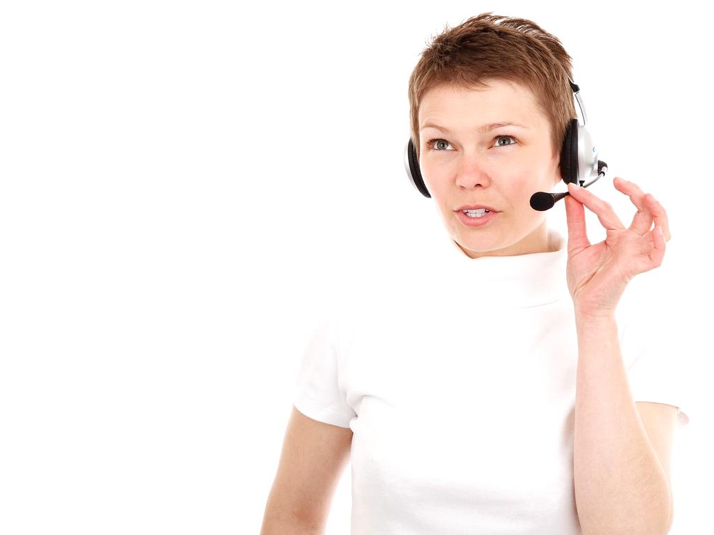 Customer support representative assisting client via headset