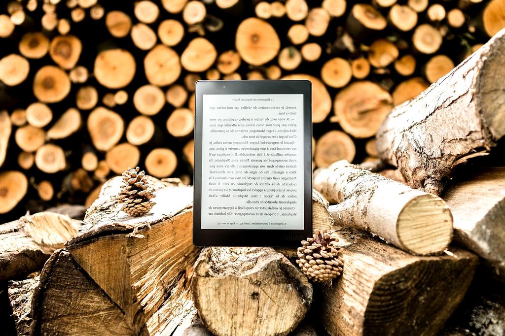 Open book with digital code flowing off the pages